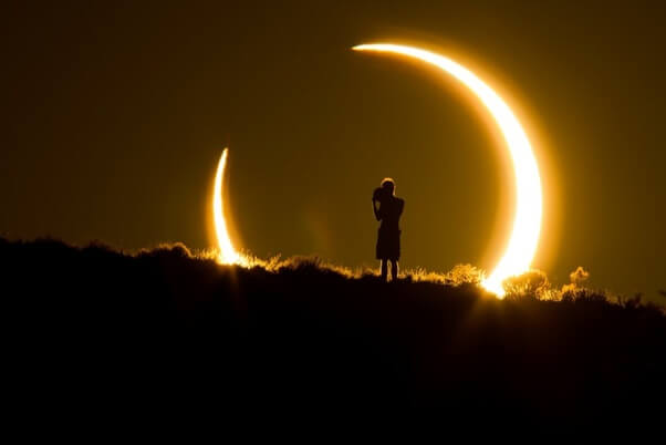 The Spectacular Confluence of a Solar Eclipse and Sunset: A Visual Journey into an Astronomical Marvel