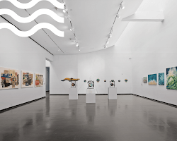 exhibition with a sign that says "Emerging Artists"