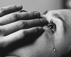 person crying, but managing their emotions